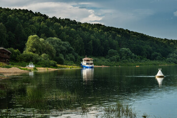 The old ship moored on the bank of the river Oka
