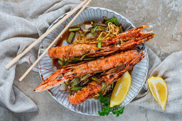 Langoustines with ginger, spring onions and crispy fried egg noodles