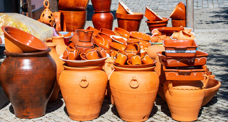 Terracotta pots and jars for sale on the street of evora city, portugal