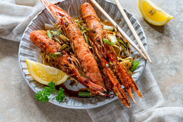 Langoustines with ginger, spring onions and crispy fried egg noodles
