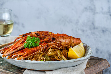 Langoustines with ginger, spring onions and crispy fried egg noodles