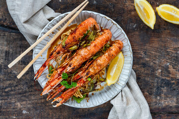 Langoustines with ginger, spring onions and crispy fried egg noodles