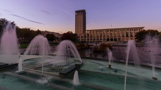 Day to Night Timelapse of the City Hall in Le Havre, France and the fountains on  the Square "Place de Hotel de Ville"