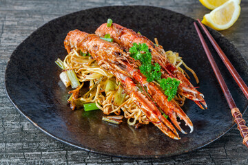Langoustines with ginger, spring onions and crispy fried egg noodles