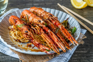 Langoustines with ginger, spring onions and crispy fried egg noodles