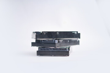 Stack of Hard Disk Drives. Pile of assembled hard drives. Isolated on white.