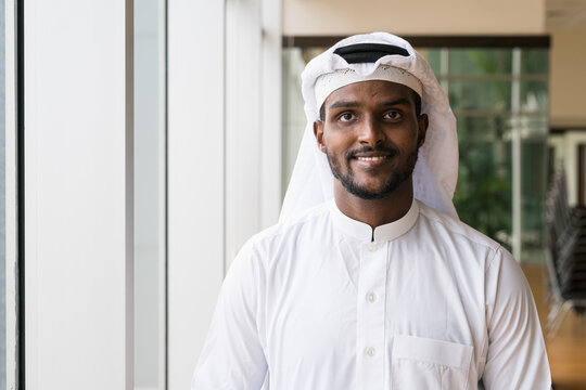 Portrait of African Muslim man wearing religious clothing an scarf at office