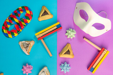 Purim celebration concept, Jewish carnival holiday, over blue purple background. Top view, Flat lay. High quality photo