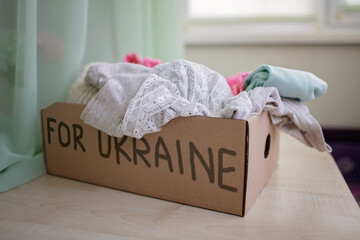 A cardboard box with humanitarian help for Ukrainian citizens suffered from Russian invasion....