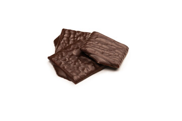 Dark chocolate candies isolated on white background.