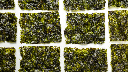 Tasty nori seaweed isolated on white.