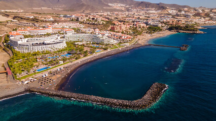 Fototapeta na wymiar El Duque beach in Tenerife, with its incredible turquoise water and golden sand, is a favourite for lovers of the sun and relaxation, and has all the amenities