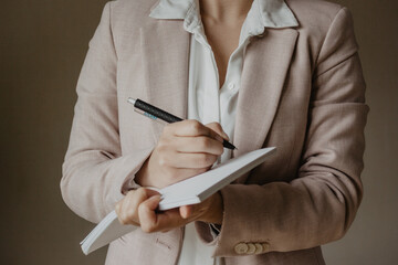 businessman writing on a notebook