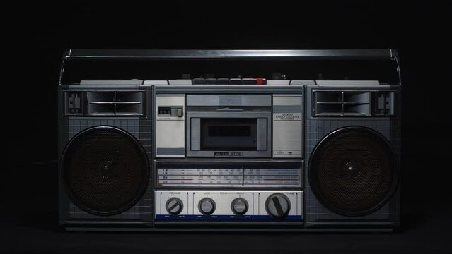 Old vintage cassette microphone on a black background. Retro and vintage concept