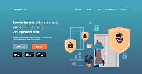 woman touching fingerprint scanner arabic girl controlling smart home devices with biometric scanning security access