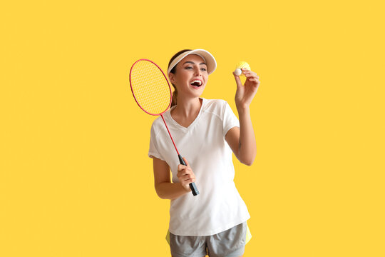 Happy Female Badminton Player On Yellow Background