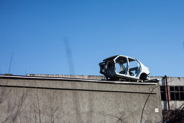 white car body lies on the roof