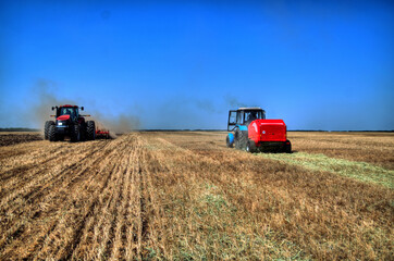 Obraz premium Tractor plowing in the field