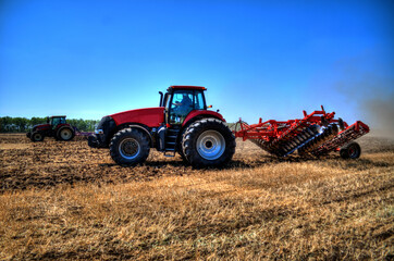 Obraz premium Tractor plowing in the field