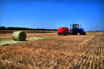 Fototapeta na wymiar Tractor plowing in the field
