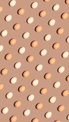 Spring season and Easter holiday concept. Minimal egg pattern idea, retro flat lay composition. Moody brown background.