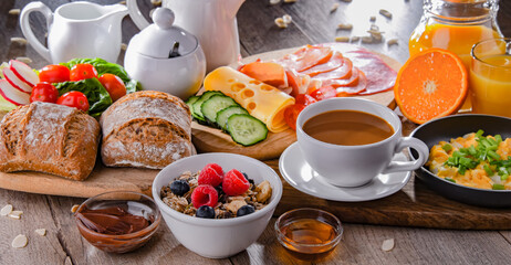 Breakfast served with coffee, scrambled eggs, cereals and ham
