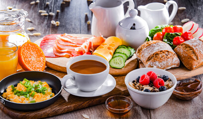 Breakfast served with coffee, scrambled eggs, cereals and ham