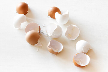 Broken and white broken egg on white background, eggshell.