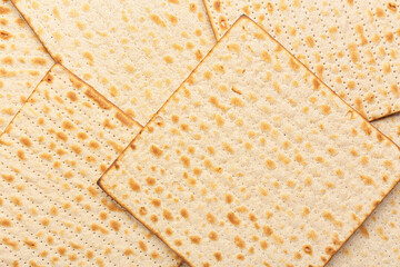 Traditional Jewish flatbread matza for Passover as background, closeup