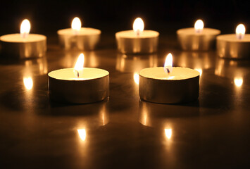 burning a lot candles in the darks Selective focus.