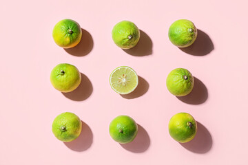 Composition with ripe bergamot fruits on pink background