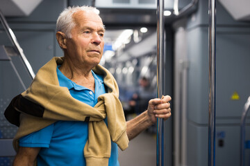 Portrait of man traveling in subway train during daily