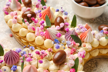 Beautiful cake for Easter celebration on light background, closeup