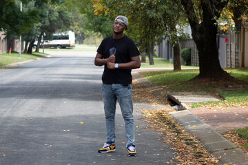 Fototapeta premium Black African Man standing in the road