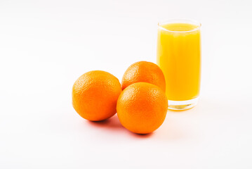 Orange juice glass with orange fruits. Isolated on white background. High resolution, copy space, healthy, vitamin drink