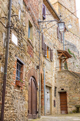 Fototapeta na wymiar Anghiari, Arezzo, Tuscany, Italy - Typical medieval village with stone walls and ancient athmosphere during cloudy day.