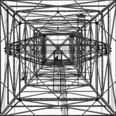 Monochrome Image of an Electrical Tower Looking Upwards  Giving a Geometric Abstract Appearance...