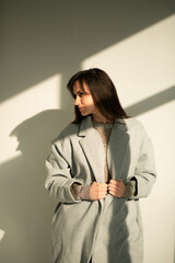 girl in a gray coat stands with his back
portrait young beautiful brunette standing sunlight long straight hair eyes brown long eyelashes girl smiling dreams
