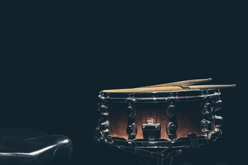 Fototapeta na wymiar Close-up, snare drum on a dark background isolated, copy space.