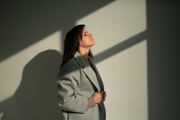 girl in a gray coat stands with his back
portrait young beautiful brunette standing sunlight long straight hair eyes brown long eyelashes girl smiling dreams
