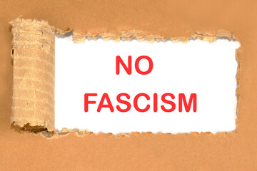no fascism the phrase written on a piece of cardboard