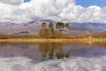 Gredos mountain landscape, in Spain, reflected on the water of a lake on a cloudy day. Selective focus. Tourism.