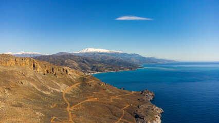 Fototapeta na wymiar Scenic aerial shot of a beautiful landscape with mountains and the sea in Crete, Greece