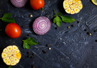 onion, spices, garlic on the old background