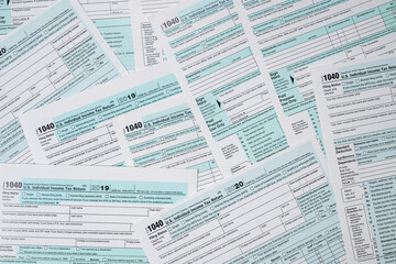 Obraz premium many 1040 us tax form as business background