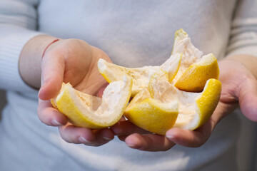 Grapefruit peels hold in hands