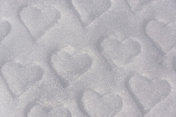 Heart on white snow, winter.