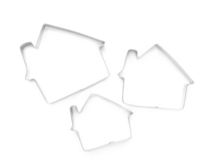House shaped cookie cutters on white background, top view