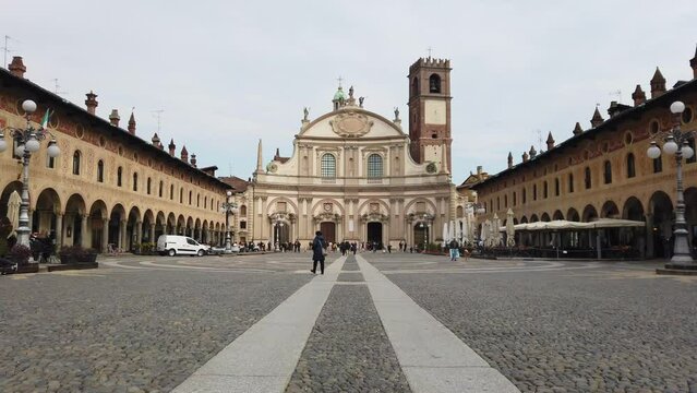 Europe, Italy , Vigevano, Lombardy  March 2022 - The Piazza Ducale of Vigevano is a large Renaissance-style square. Founded in  1492 at the behest of Ludovico il Moro , Sant'Ambrogio Cathedral