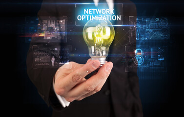 Businessman holding a light bulb, online security concept